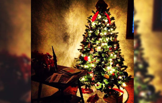 An old fashioned Christmas tree in a home setting
