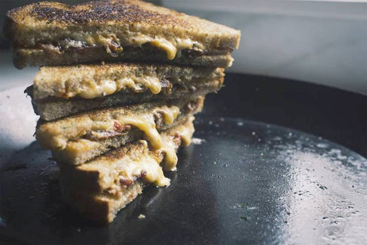 grilled cheed sandwhiches in a cast iron skillet