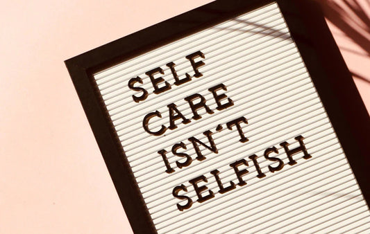 Self Care Isn't Selfish written on a sign