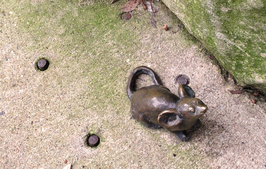 A Mice on Main mouse on a sidewalk