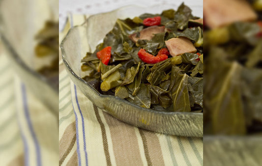A bowl of collard greens on a table