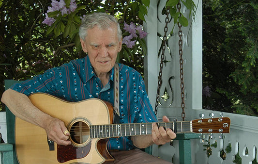 Doc Watson playing on the porch at the Mast Farm Inn