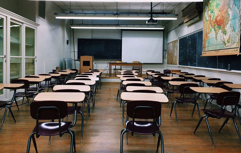 An empty classroom that is getting ready to welcome back students