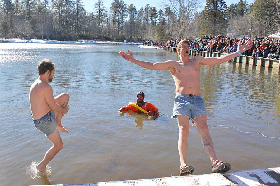 Two men taking the polar plunge