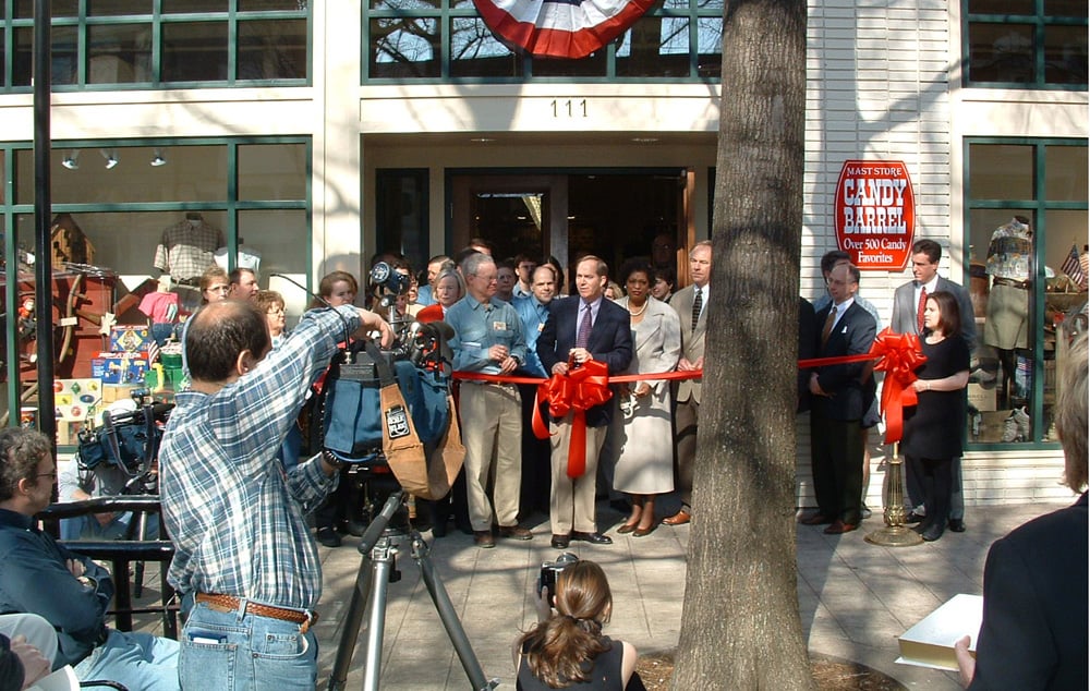 Media and dignitaries gather outside the Mast Store in Greenville in March 2003 for the ribbon cutting