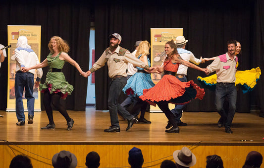 The Green Grass Cloggers perform a traditional clogging routine