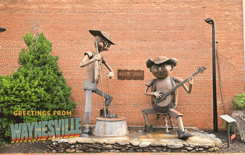 A statue constructed of scrap iron of two bluegrass players located on Waynesville's Main Street.