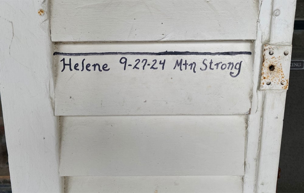 The high water mark on the front door of the Mast Store Annex in Valle Crucis shows the date of Helene's highest water.