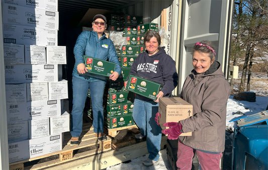 Mast Store volunteers at the Hunger & Health Coalition unload a storage unit