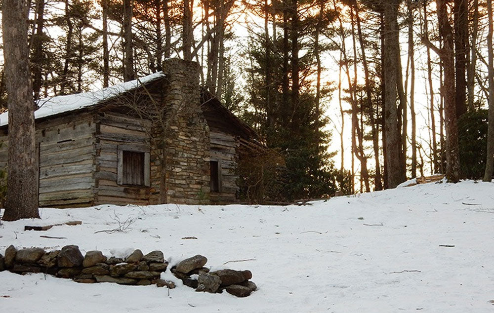 Tatum Cabin at Hickory Ridge sits covered with snow