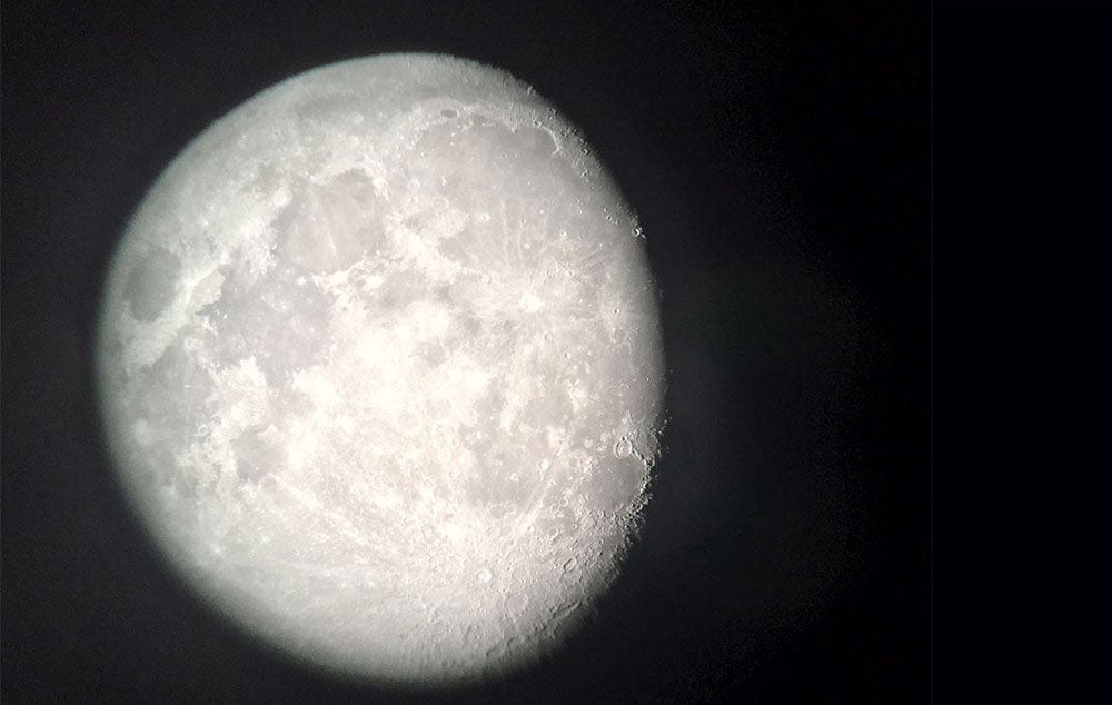 A nearly full moon at night