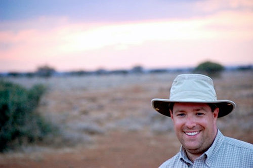 Man wearing a Tilley hats in the outback