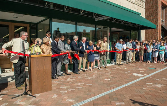 Opening day ribbon cutting with Winston-Salem dignitaries and Mast Store Staff