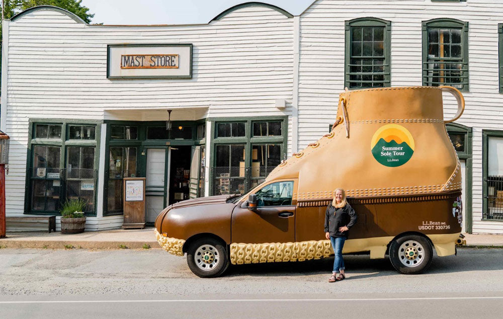 Lisa Cooper, president of Mast General Store, stands with L.L.Bean boot in front of the Original Mast Store in Valle Crucis.