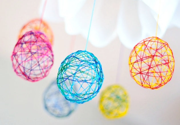 Kid's Crafts string balls hangin on a string