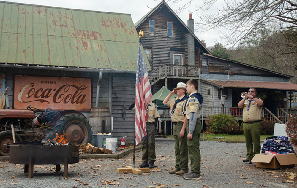Members of Scout Troop 109 help retire United States flags