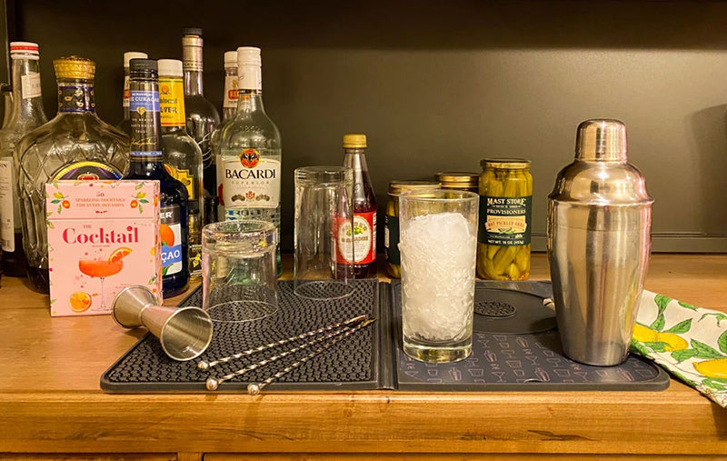 Bartending gear including liquor bottles, shaker and swizzle sticks