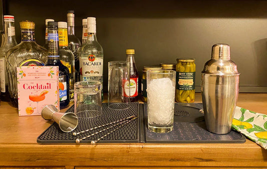 Bartending gear including liquor bottles, shaker and swizzle sticks