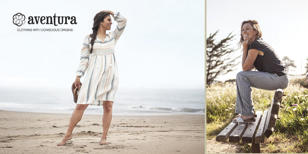 Two women in casual Aventura outfits on a beach and grassy area.