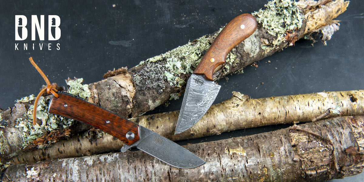 Two BNB Knives with wooden handles on logs.