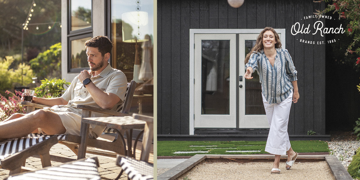 Man sitting on a patio while a woman plays bocce in a backyard, both wearing Old Ranch clothing.