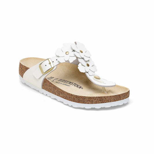 White Birkenstock sandals with floral strap design and cork footbed, perfect for comfort and style in warm weather.