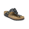 Black floral thong sandals with adjustable buckle and cork footbed, perfect for casual summer wear.