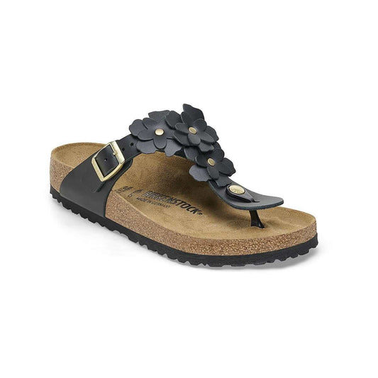 Black floral thong sandals with adjustable buckle and cork footbed, perfect for casual summer wear.