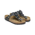 Black floral sandals from Birkenstock with a comfortable cork footbed and adjustable strap, perfect for summer style and comfort.