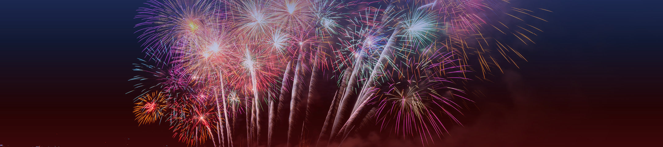 Colorful fireworks display against a dark sky