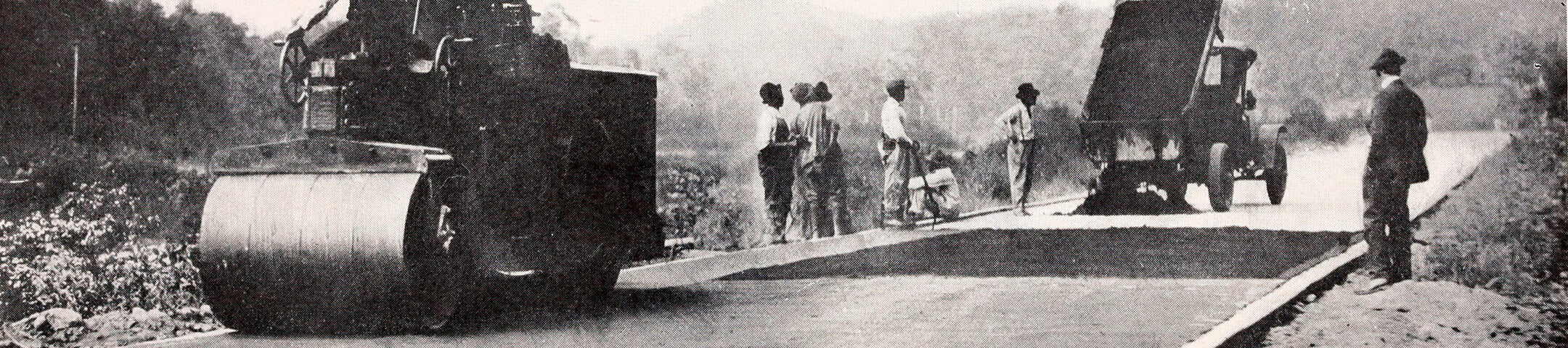 Historic black‑and‑white photograph of an early 20th‑century North Carolina mountain road under construction.